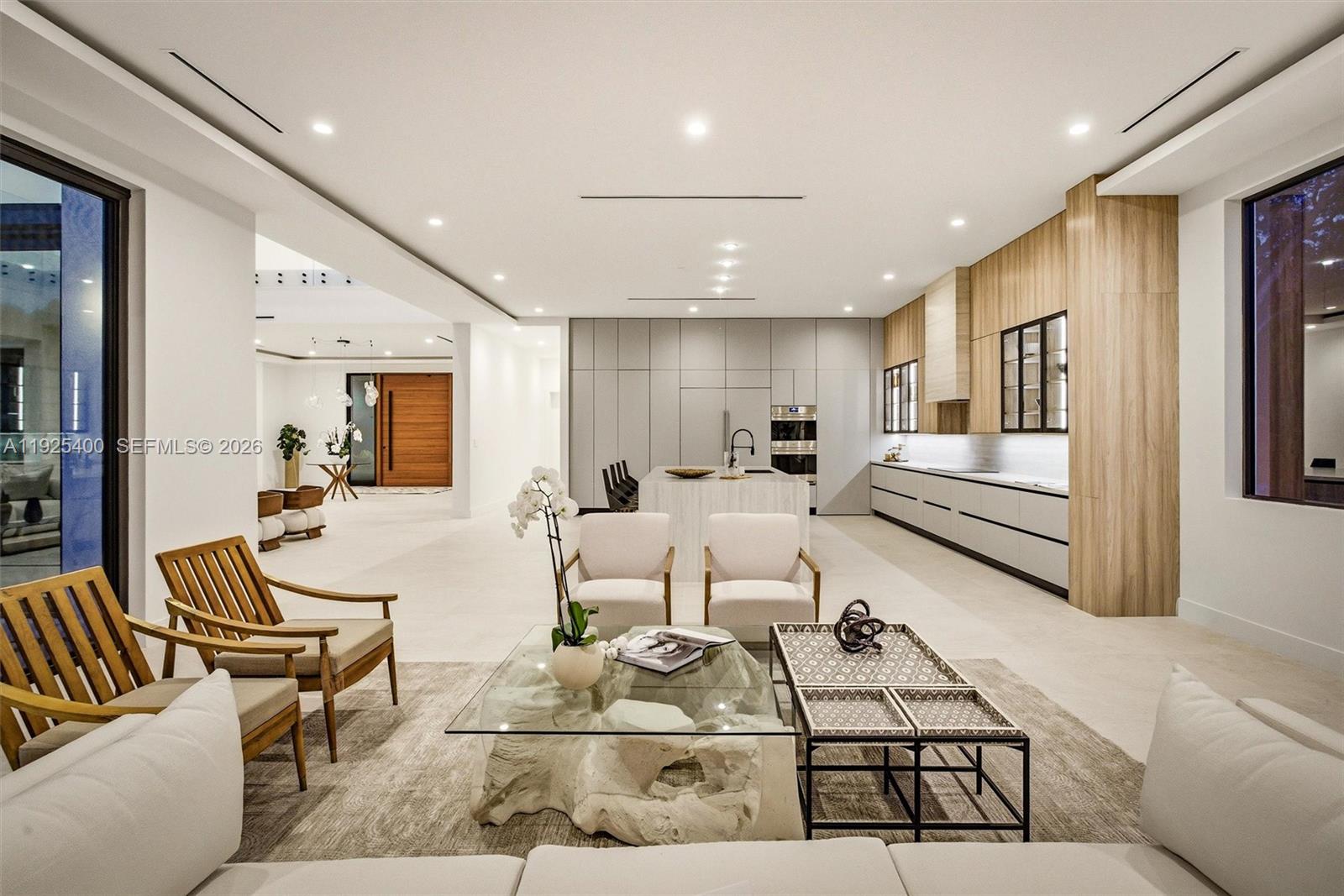 9840 Southwest 73rd Court Pinecrest, FL 33156 - Photo 24 of 67 Open-Plan Family Room & Kitchen | Pivot Door | Designer Furnishings | Pinecrest FL