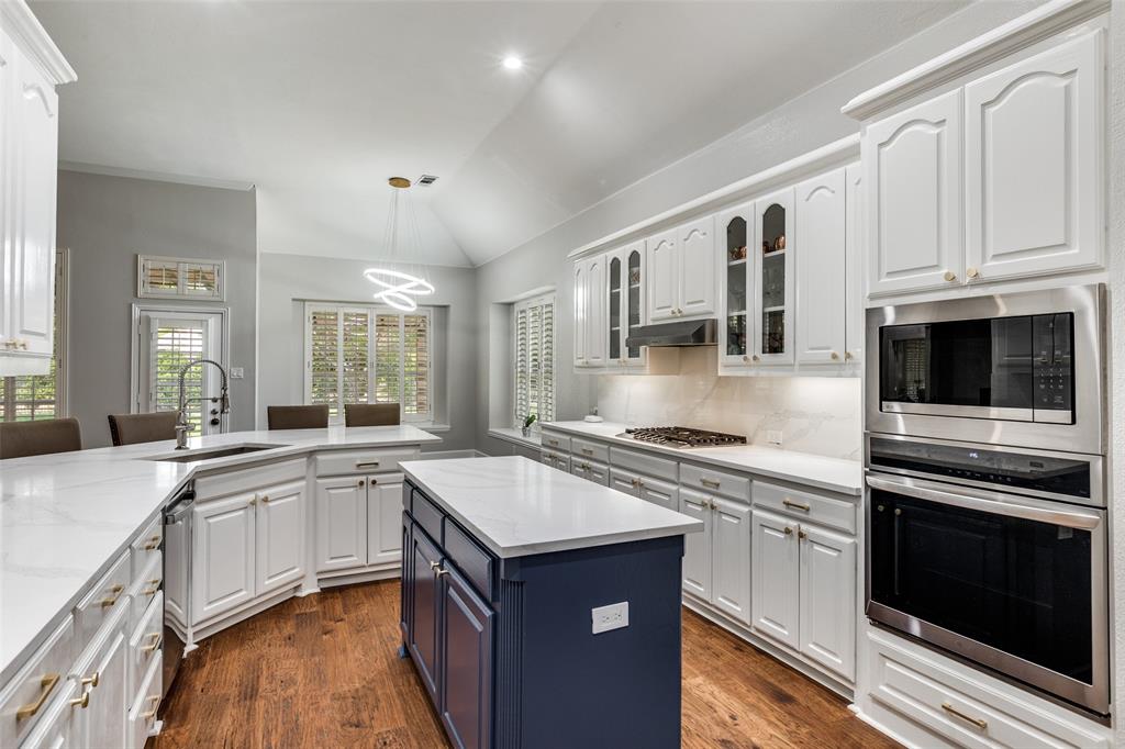 5809 Rathbone Drive Parker, TX 75002 - Photo 12 of 36 a kitchen with stainless steel appliances granite countertop a stove and a sink