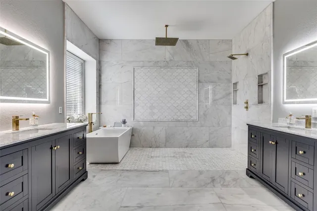 a bath room with a sink a mirror and a bathtub