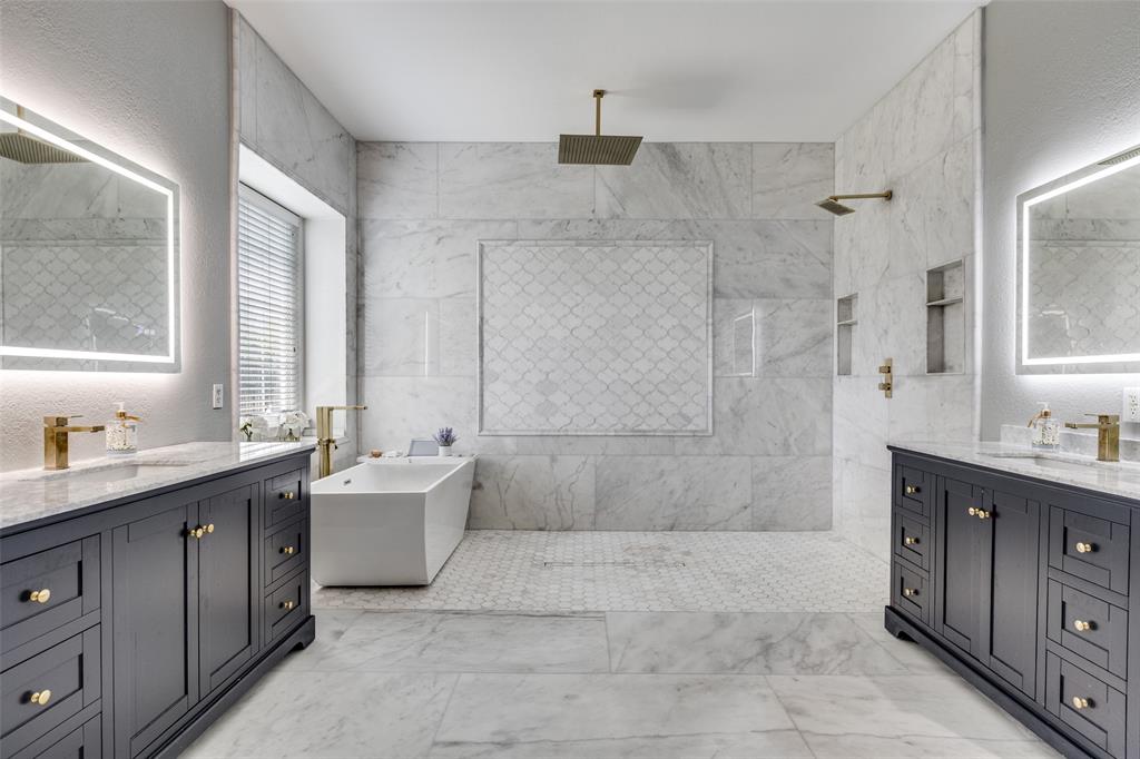 5809 Rathbone Drive Parker, TX 75002 - Photo 18 of 36 a bath room with a sink a mirror and a bathtub