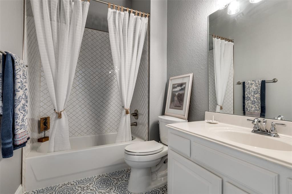 5809 Rathbone Drive Parker, TX 75002 - Photo 20 of 36 a bathroom with a sink toilet and shower