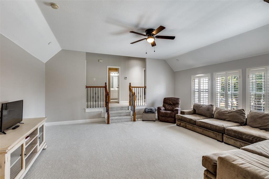 5809 Rathbone Drive Parker, TX 75002 - Photo 22 of 36 a living room with furniture and a flat screen tv
