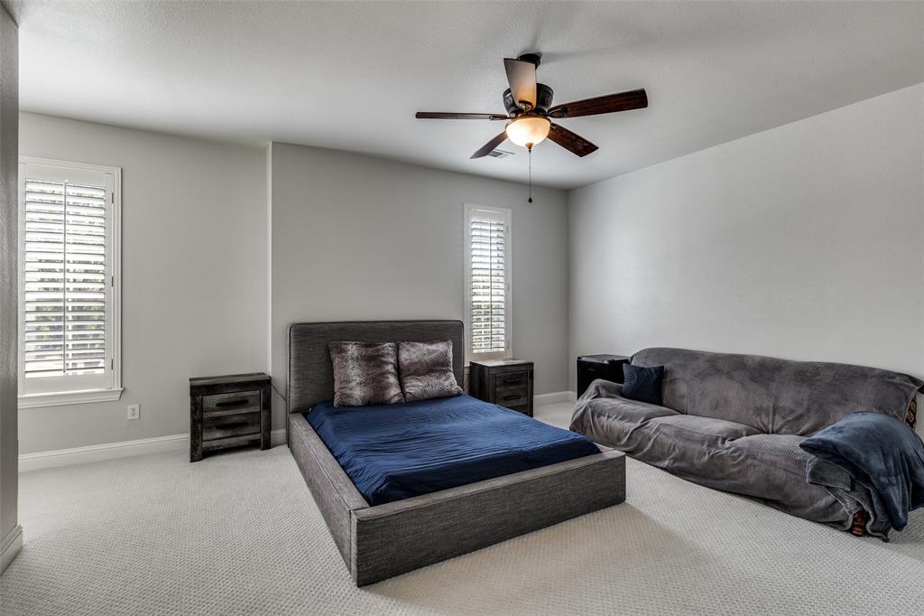 5809 Rathbone Drive Parker, TX 75002 - Photo 25 of 36 a living room with furniture a ceiling fan and a window