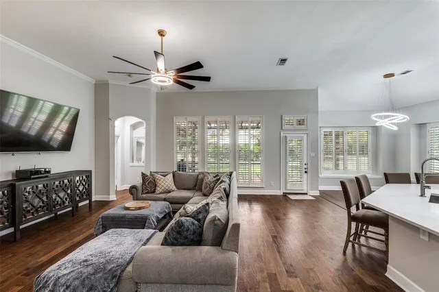 a living room with furniture fireplace and a flat screen tv