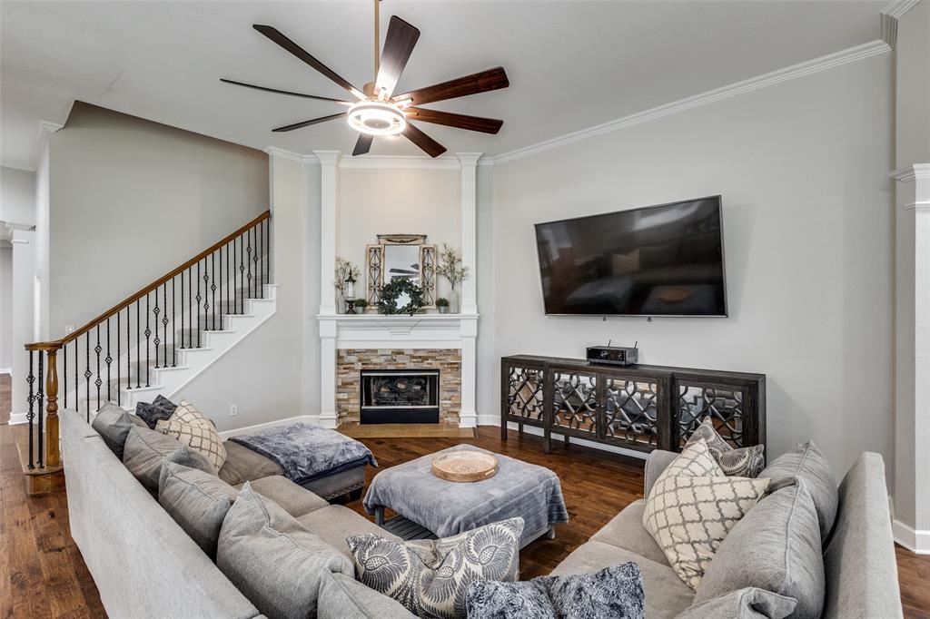 5809 Rathbone Drive Parker, TX 75002 - Photo 9 of 36 a living room with fireplace furniture and a flat screen tv