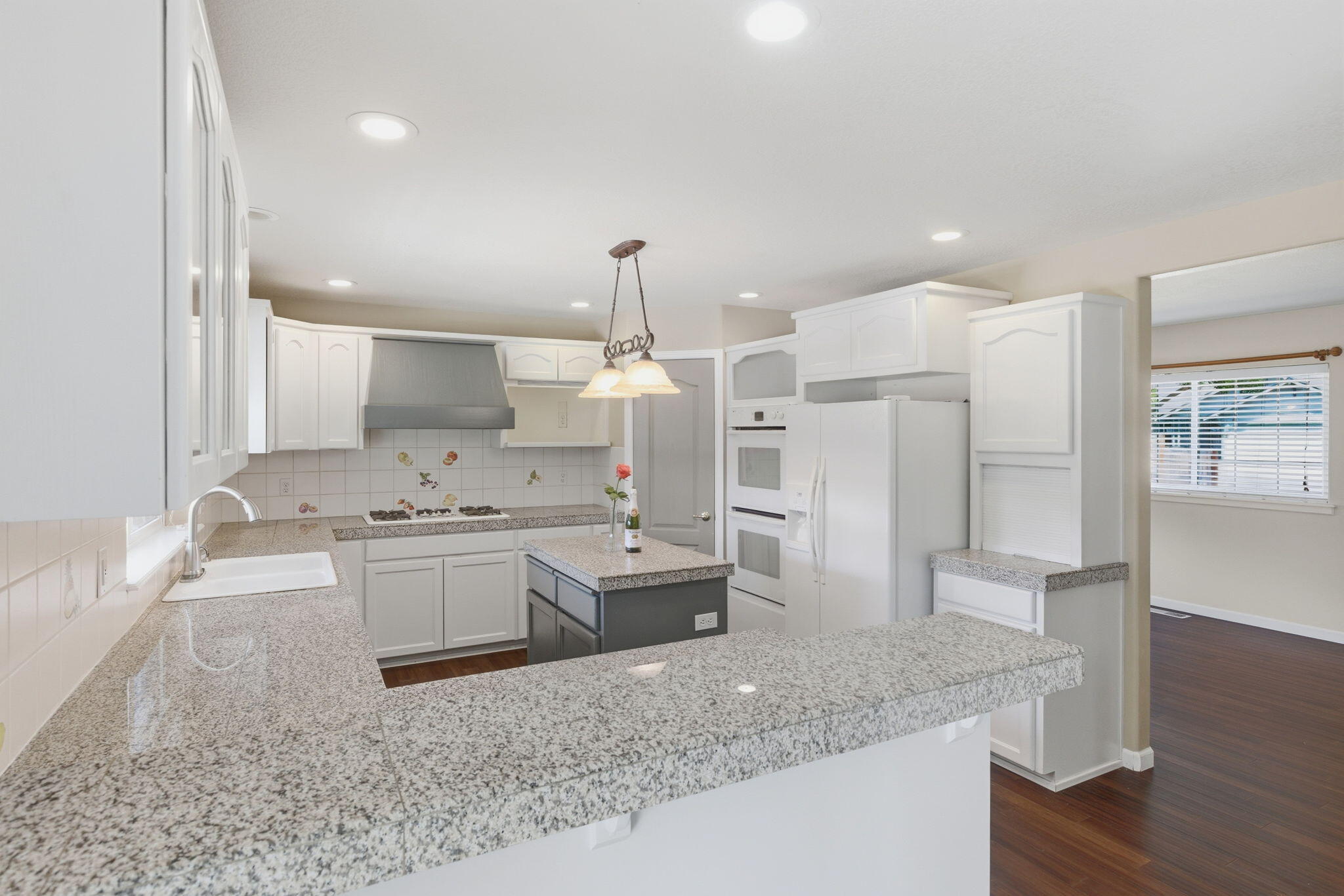 196 Nadine Lane Central Point, OR 97502 - Photo 12 of 54 a kitchen with stainless steel appliances granite countertop a sink refrigerator and cabinets