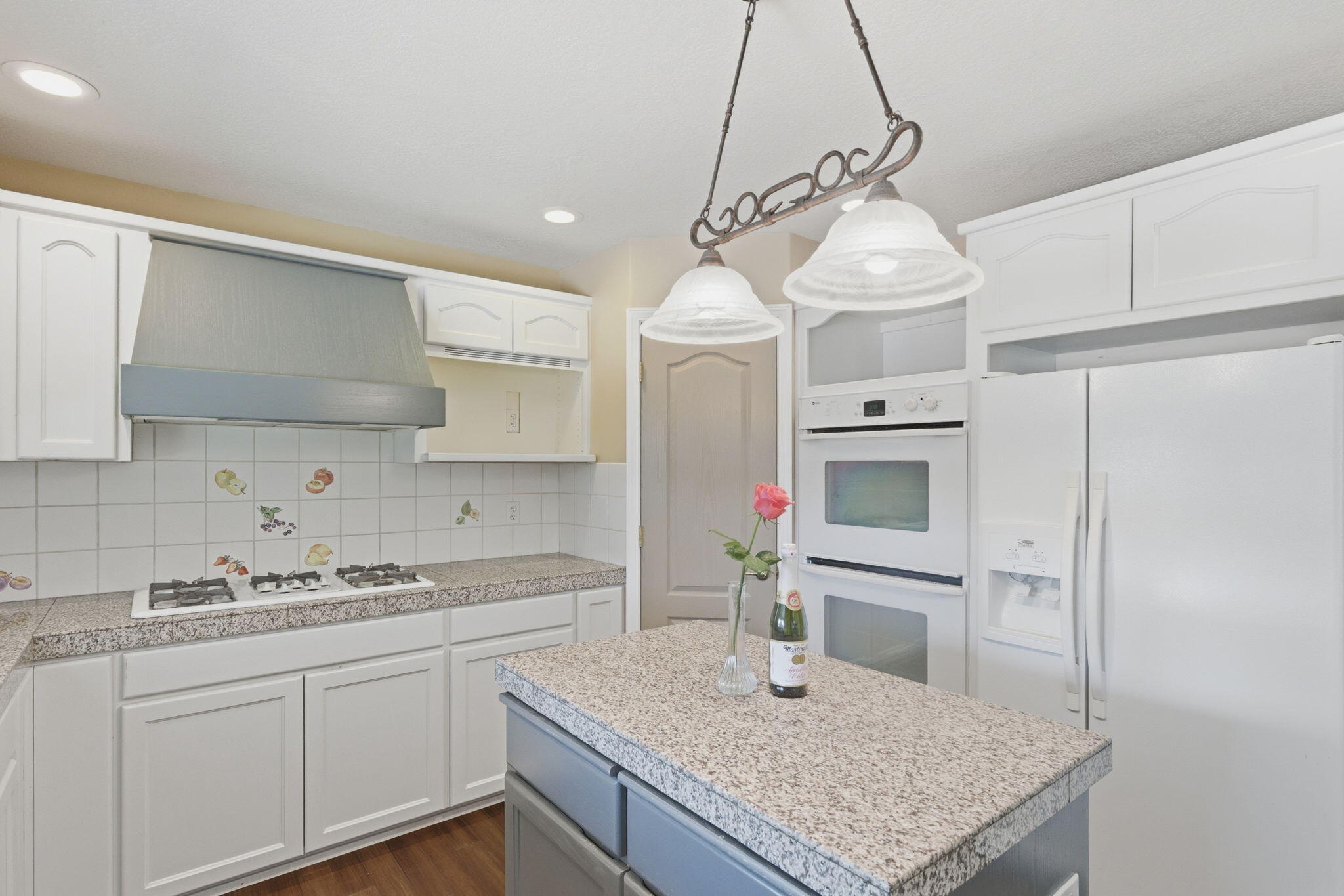 196 Nadine Lane Central Point, OR 97502 - Photo 14 of 54 a kitchen with stainless steel appliances granite countertop a sink a microwave a refrigerator and white cabinets