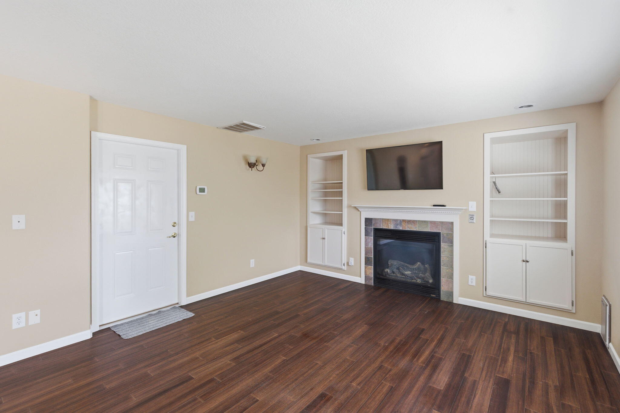 196 Nadine Lane Central Point, OR 97502 - Photo 18 of 54 a view of a livingroom with a fireplace and a hardwood floor