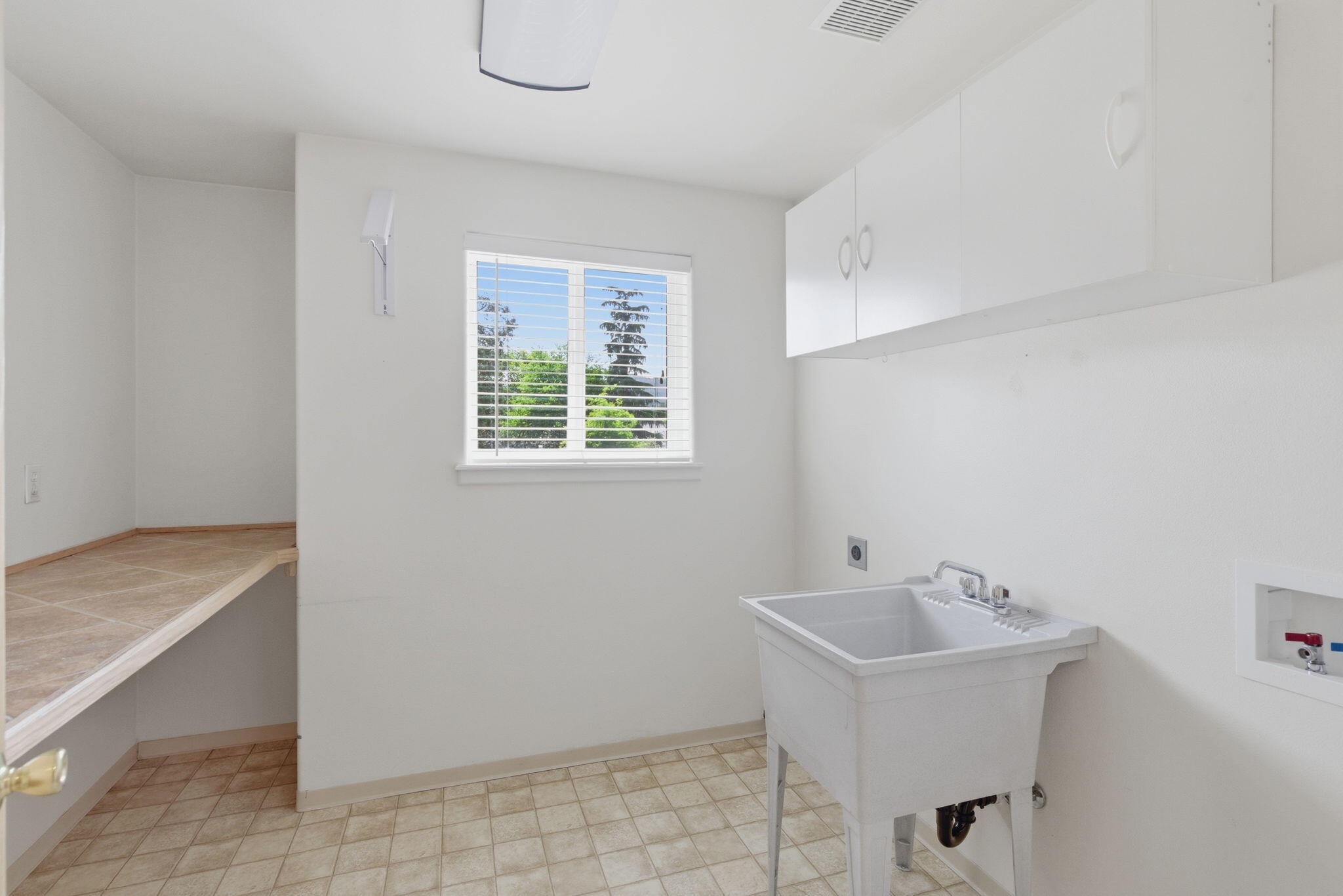 196 Nadine Lane Central Point, OR 97502 - Photo 29 of 54 a white bath tub sitting in a bathroom next to a sink