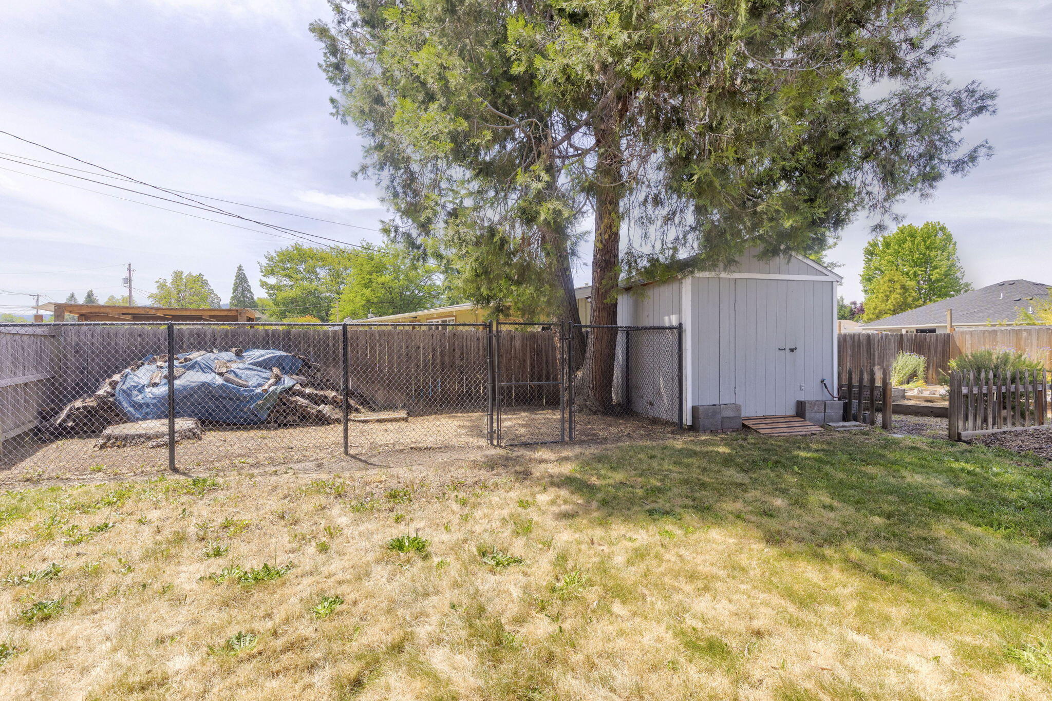 196 Nadine Lane Central Point, OR 97502 - Photo 41 of 54 a backyard of a house with table and chairs