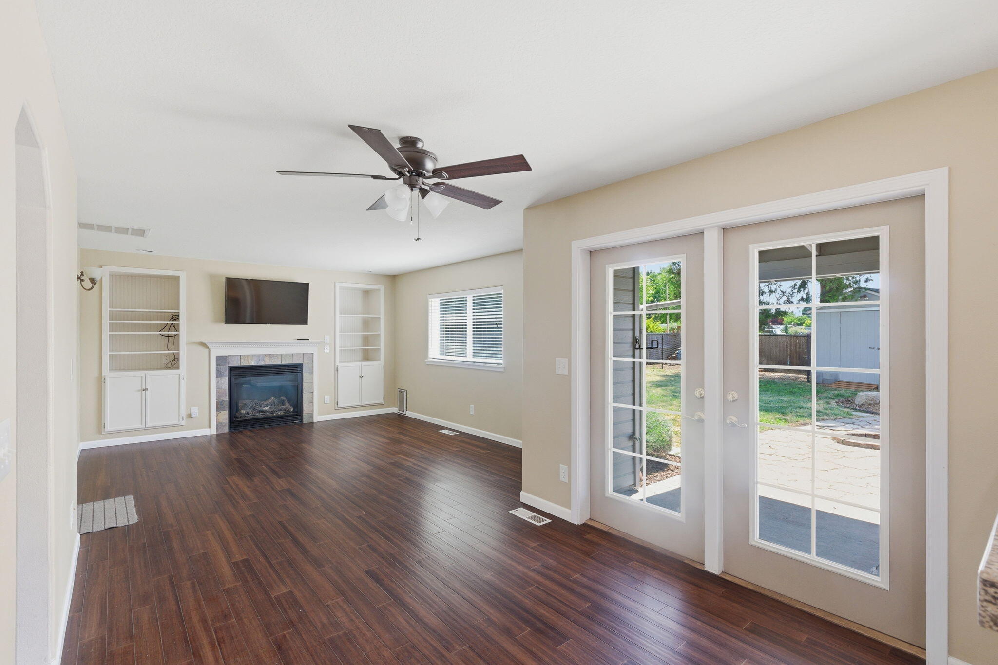 196 Nadine Lane Central Point, OR 97502 - Photo 5 of 54 a view of a livingroom with fireplace wooden floor and window