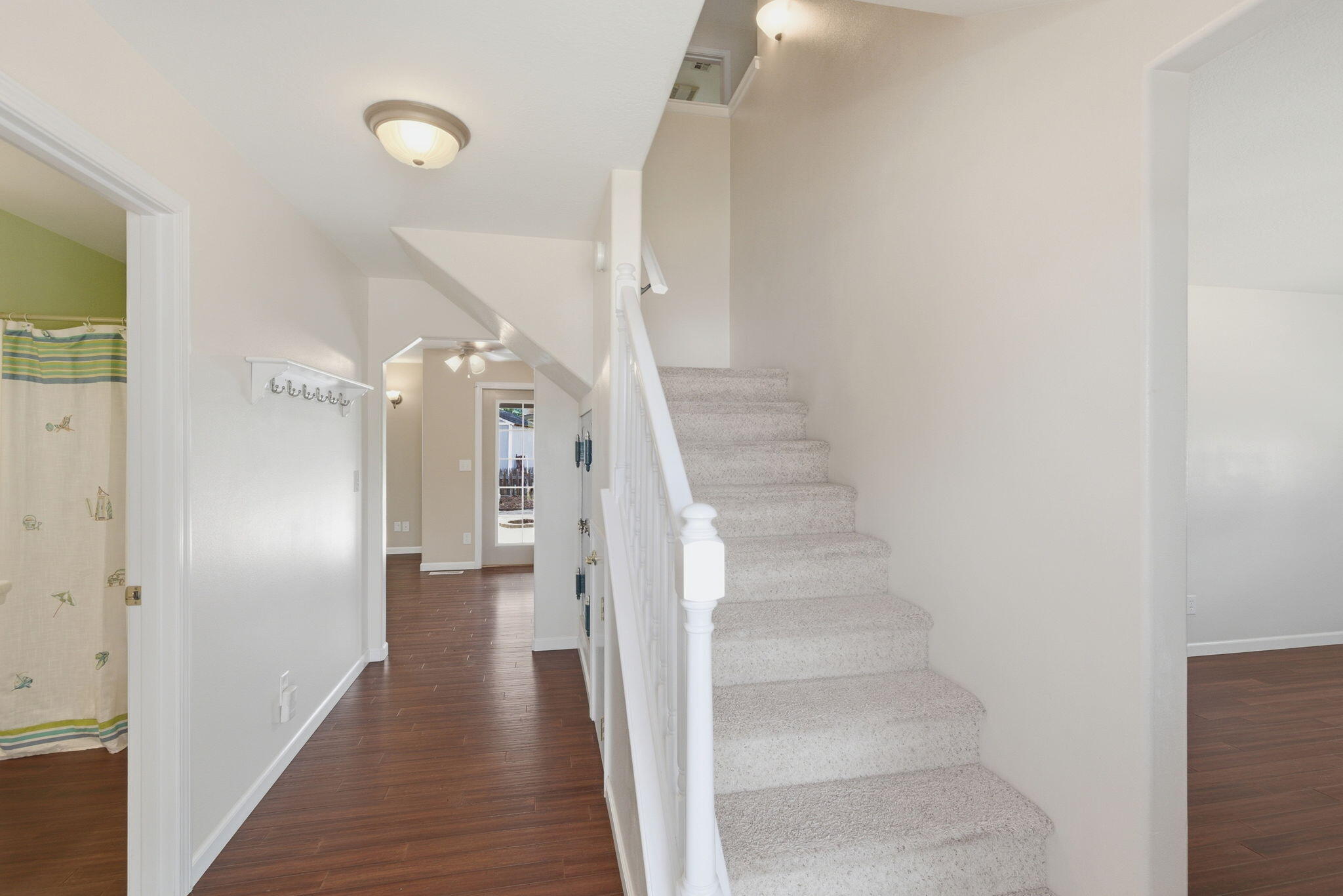 196 Nadine Lane Central Point, OR 97502 - Photo 6 of 54 a view of a hallway with wooden floor and entryway