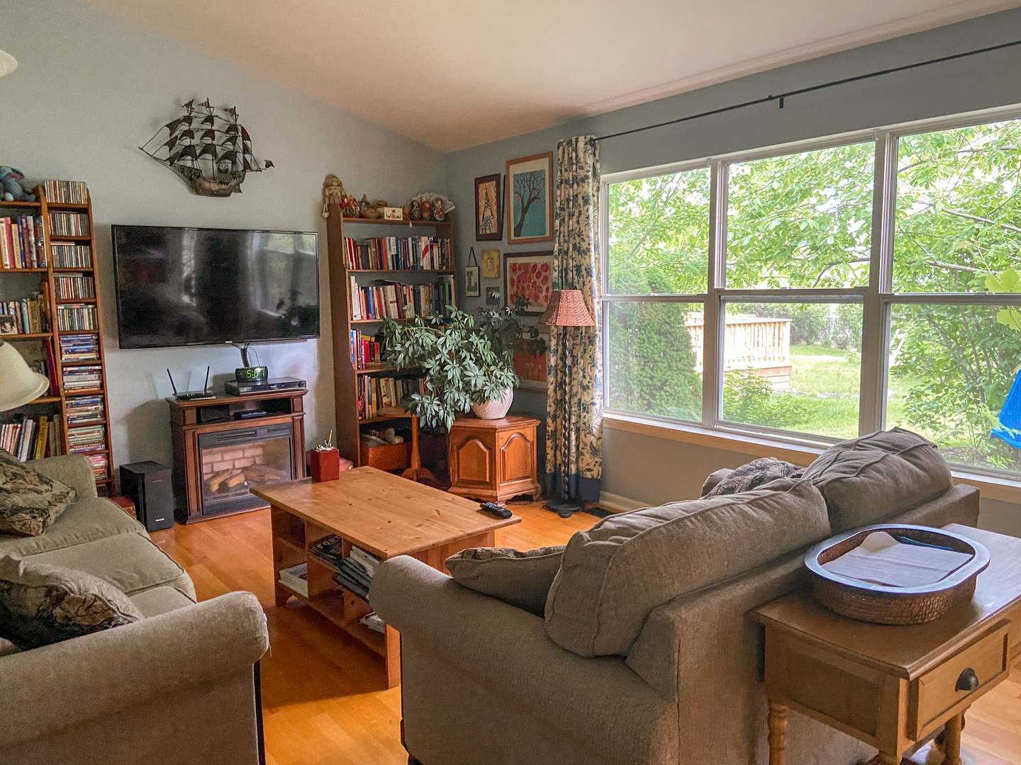 233 Dickens Trail Elgin, IL 60120 - Photo 2 of 18 a living room with furniture and a flat screen tv