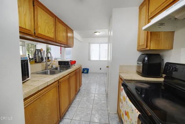 a kitchen with stainless steel appliances granite countertop a sink and cabinets