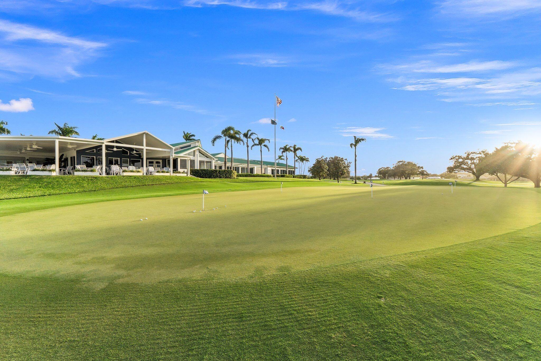3374 Southeast Fairway East Stuart, FL 34997 - Photo 59 of 65 a view of an ocean with a building in the background