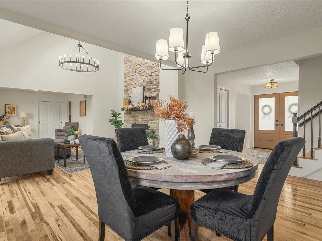 9281 Auburn Road Winnebago, IL 61088 - Photo 11 of 64 a view of a dining room with furniture wooden floor and chandelier
