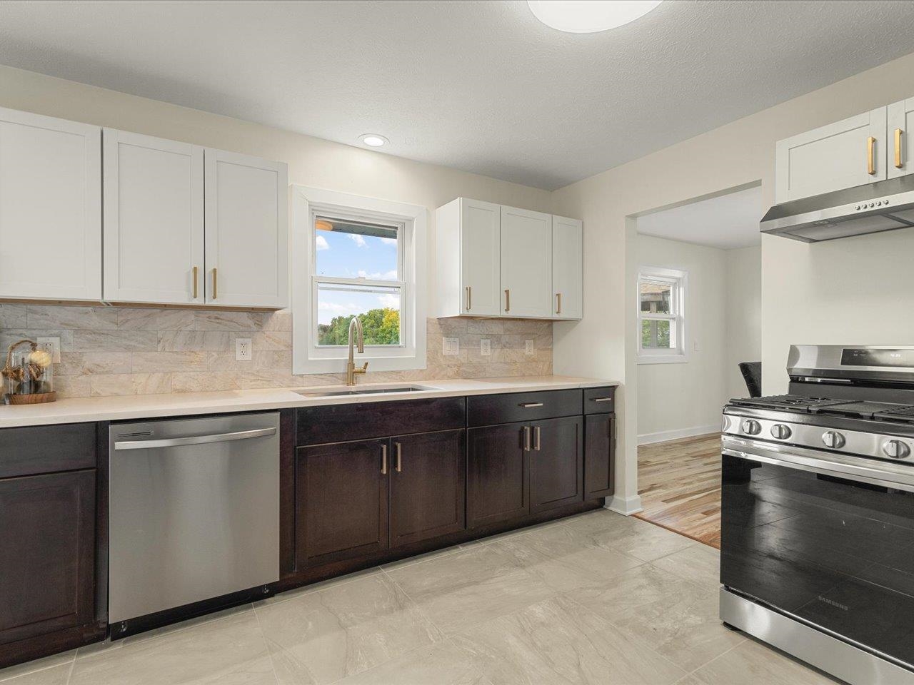 9281 Auburn Road Winnebago, IL 61088 - Photo 24 of 64 a kitchen with stainless steel appliances granite countertop a stove a sink and a microwave
