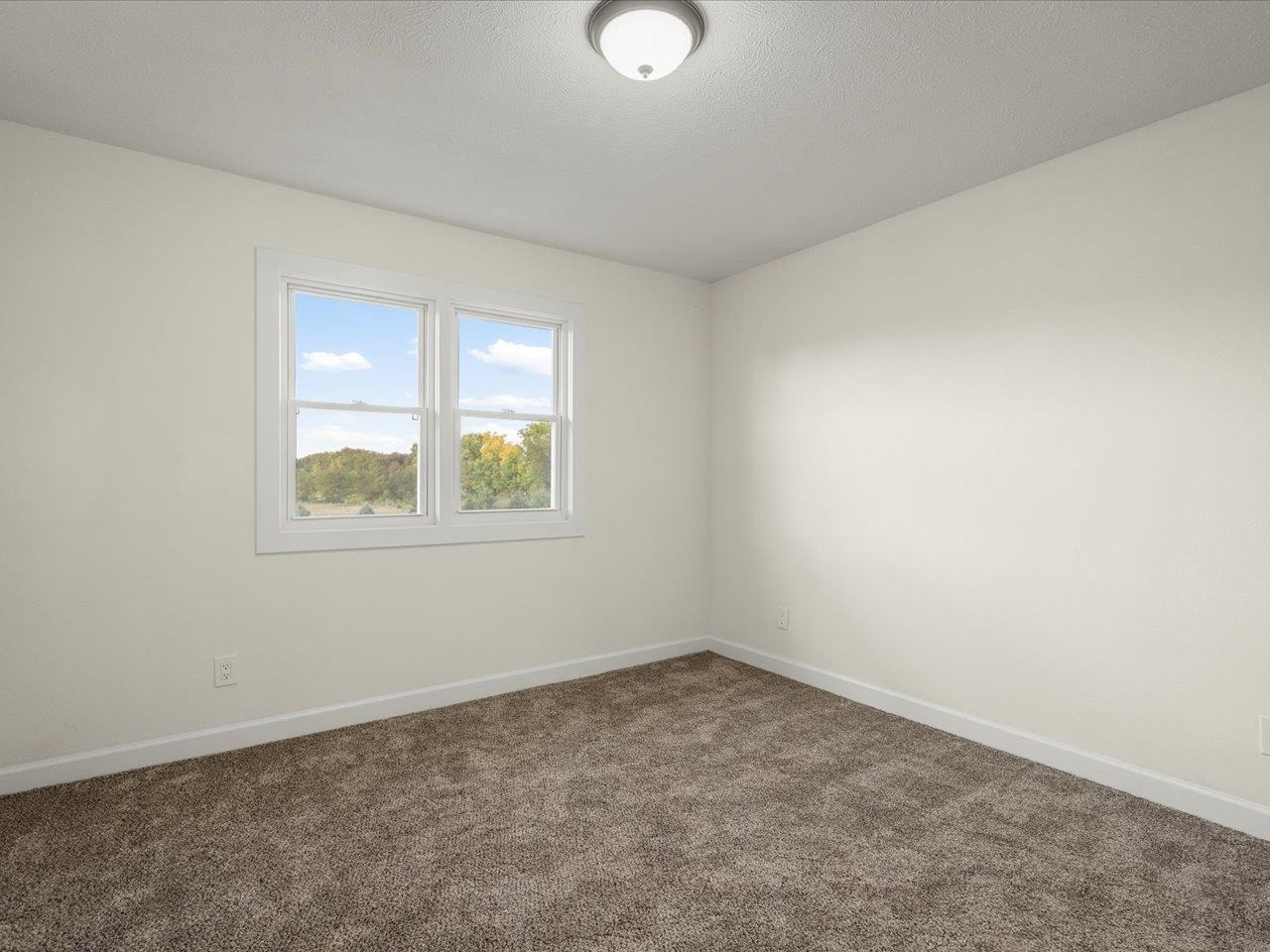 9281 Auburn Road Winnebago, IL 61088 - Photo 37 of 64 an empty room with a window