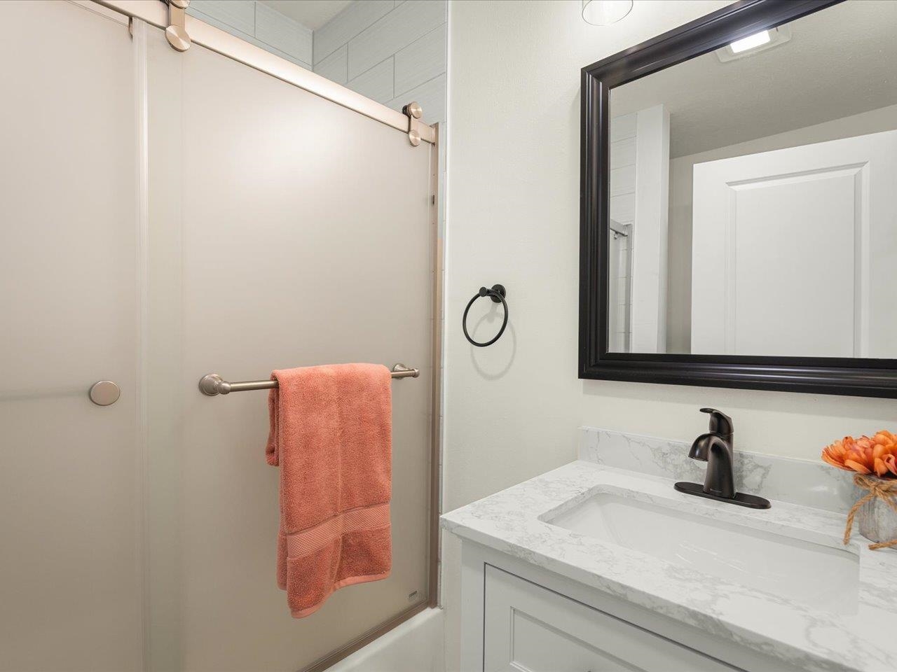 9281 Auburn Road Winnebago, IL 61088 - Photo 41 of 64 a bathroom with a sink and a mirror