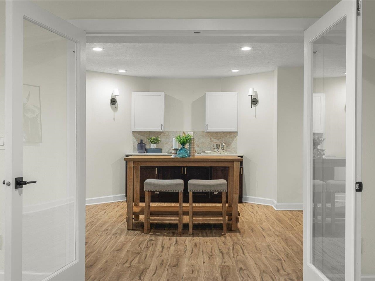 9281 Auburn Road Winnebago, IL 61088 - Photo 46 of 64 a hallway with a table and chairs