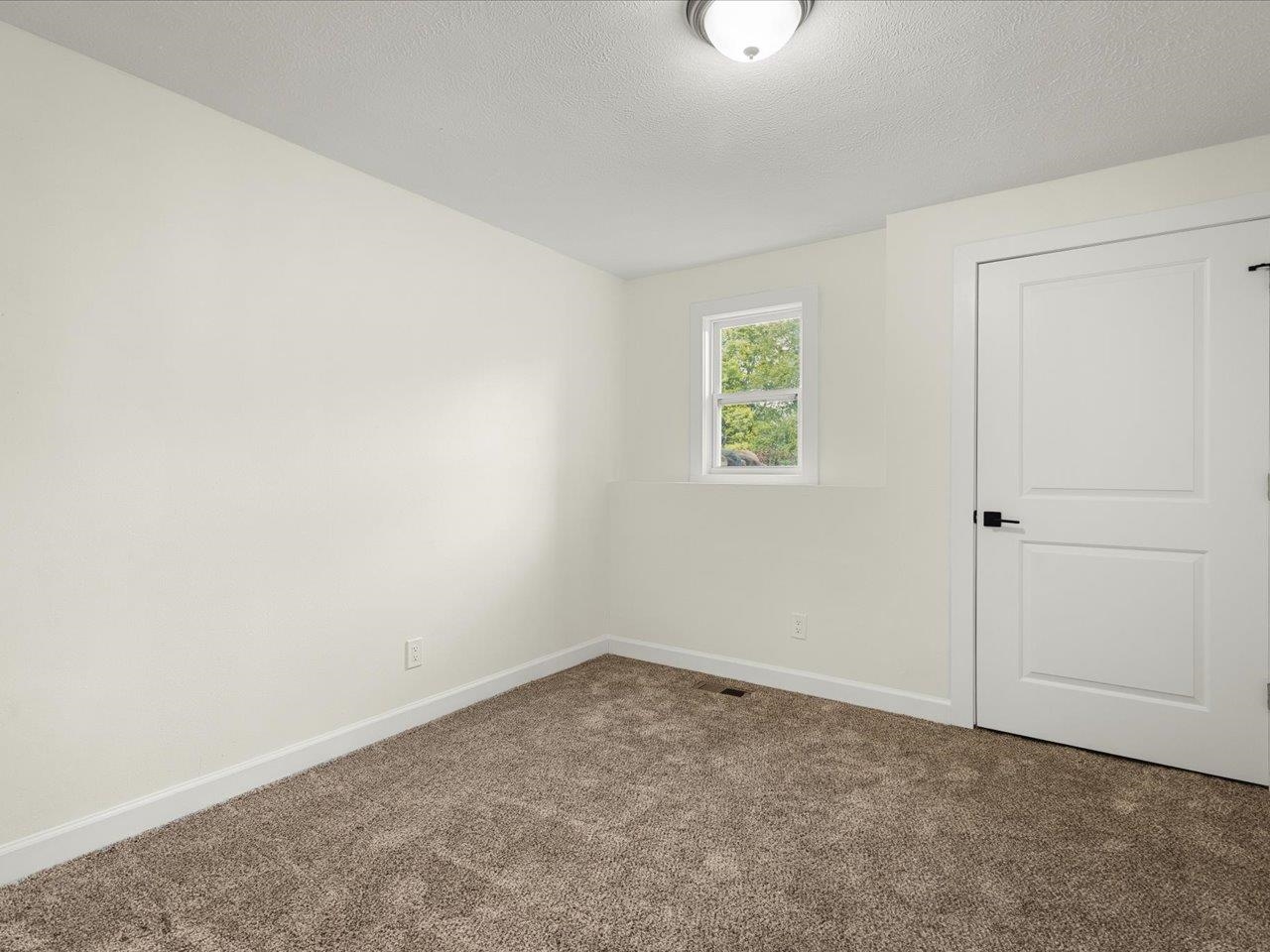 9281 Auburn Road Winnebago, IL 61088 - Photo 48 of 64 an empty room with a window