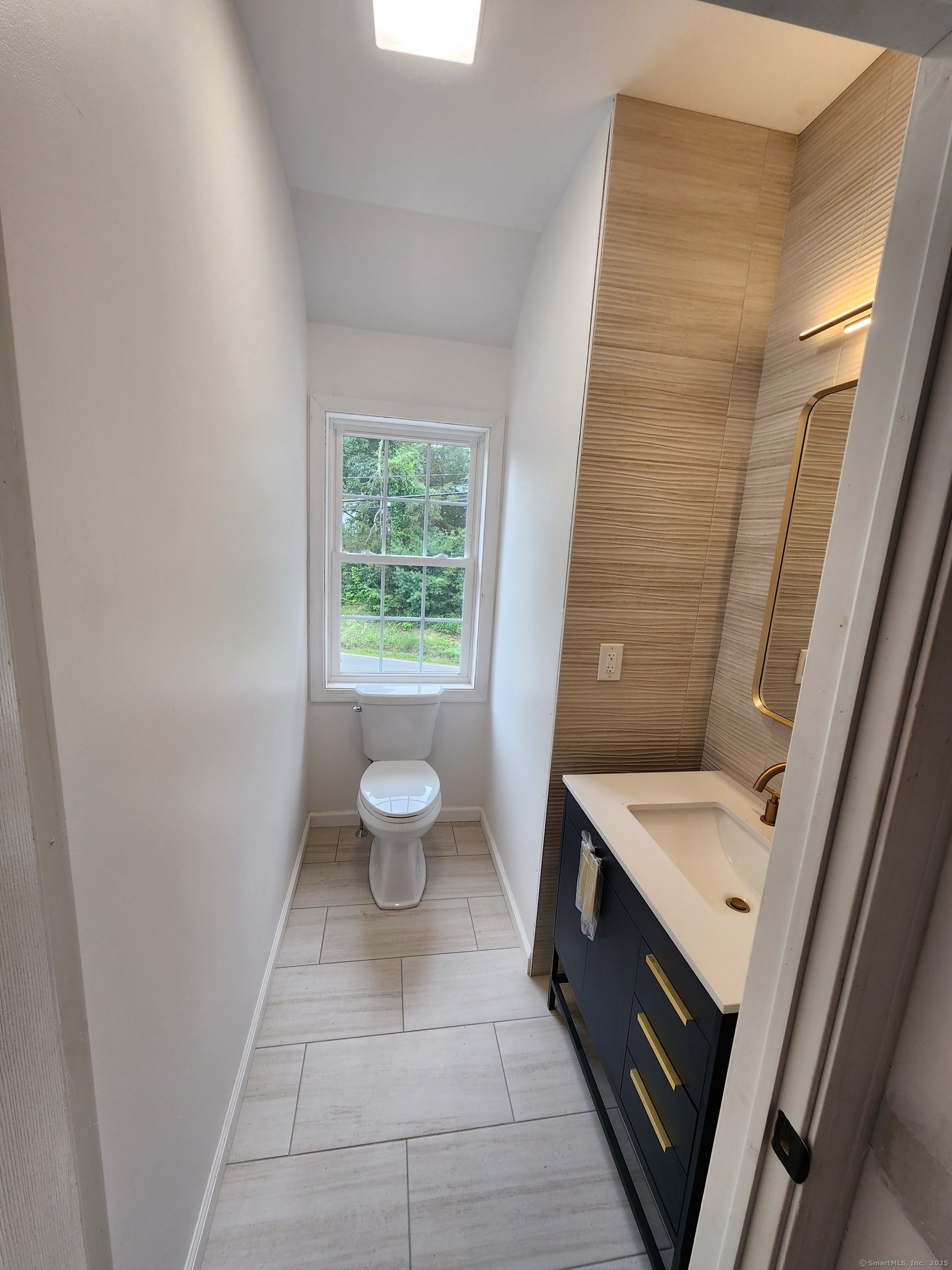 154 Falls Road East Haddam, CT 06469 - Photo 14 of 39 a bathroom with a sink a toilet a mirror and a tub