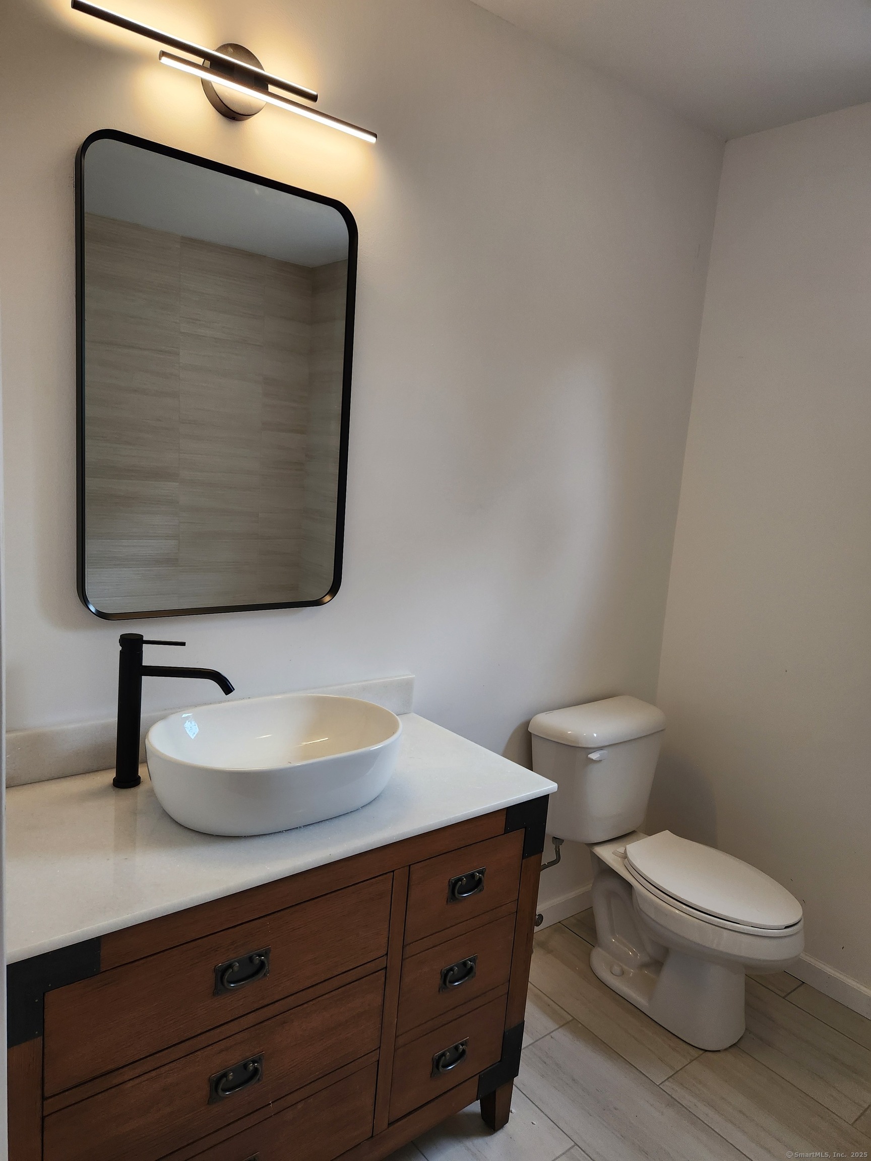 154 Falls Road East Haddam, CT 06469 - Photo 15 of 39 a bathroom with a toilet sink and mirror