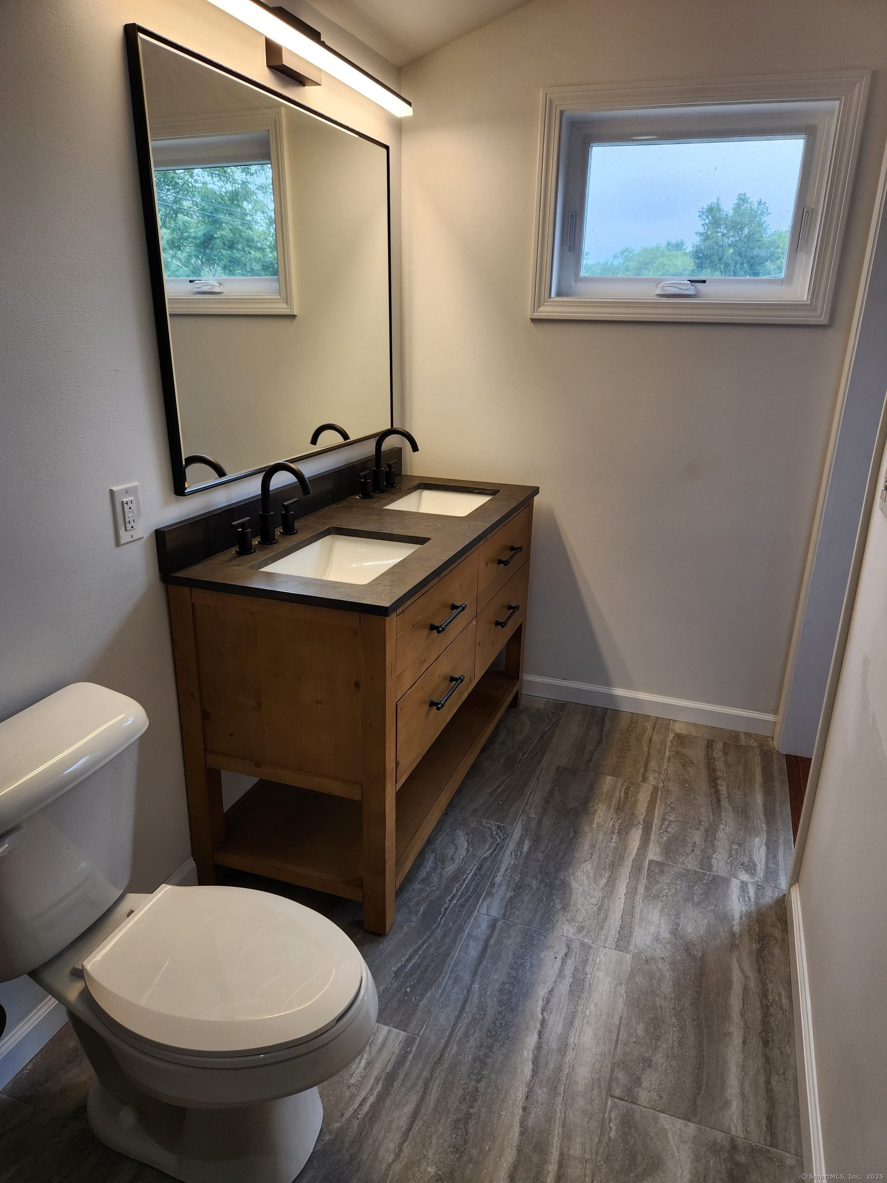 154 Falls Road East Haddam, CT 06469 - Photo 20 of 39 a bathroom with a toilet sink and mirror