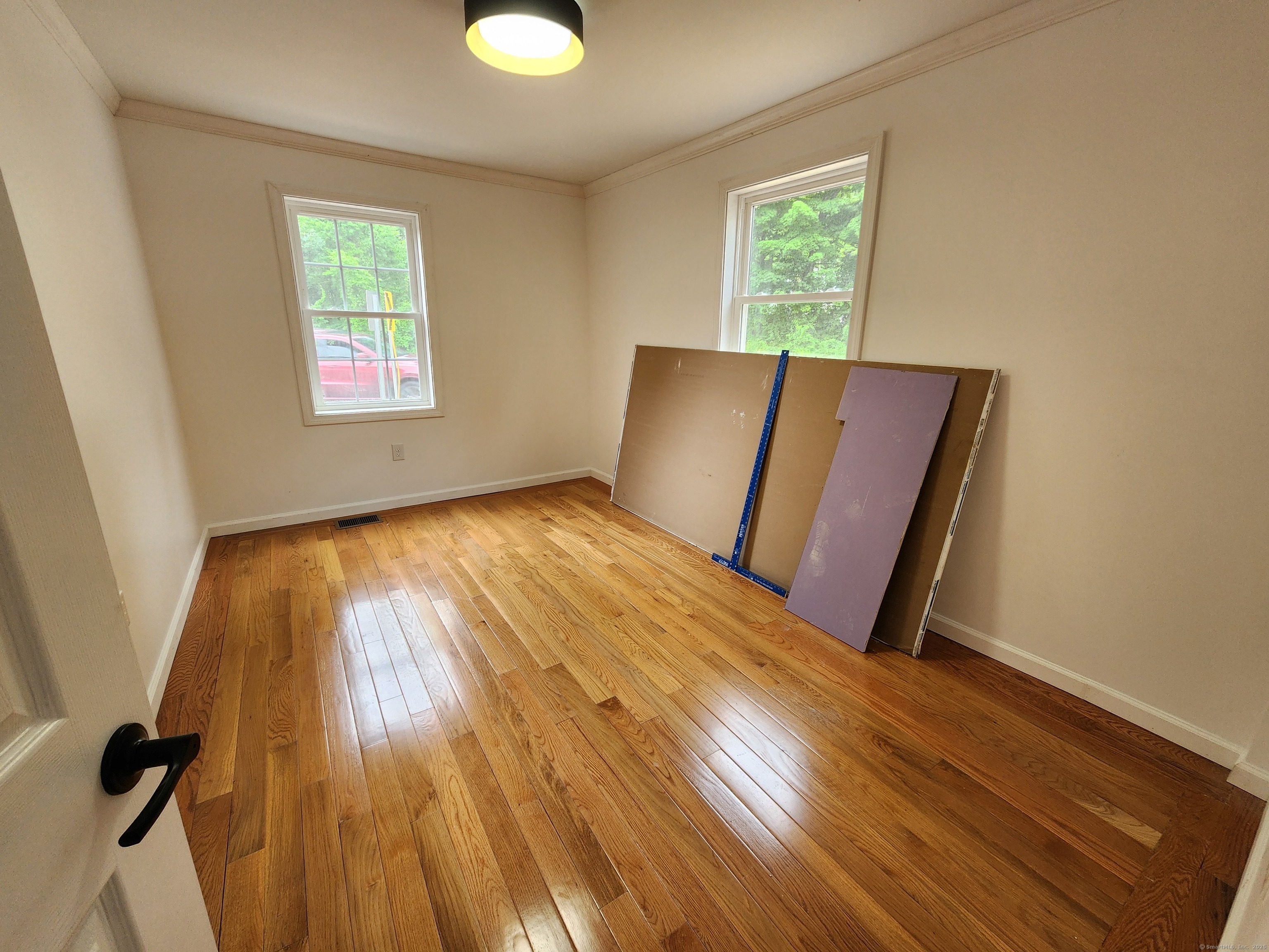 154 Falls Road East Haddam, CT 06469 - Photo 22 of 39 a view of a room with wooden floor staircase and windows
