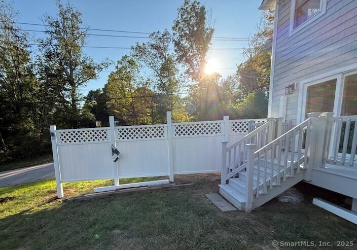 154 Falls Road East Haddam, CT 06469 - Photo 29 of 39 a view of a deck with a bench and wooden fence