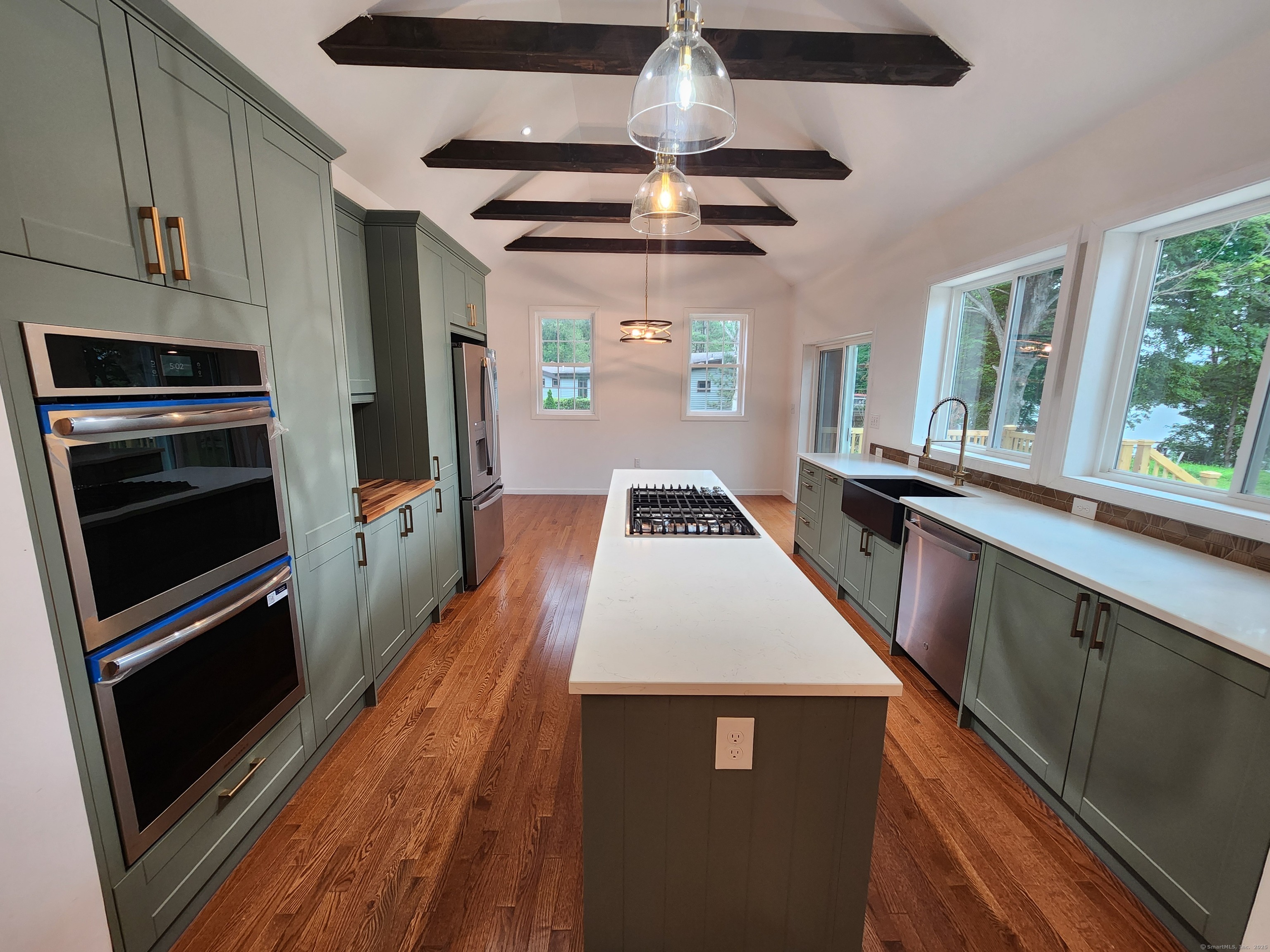 154 Falls Road East Haddam, CT 06469 - Photo 3 of 39 a kitchen with stainless steel appliances a stove a sink and a refrigerator