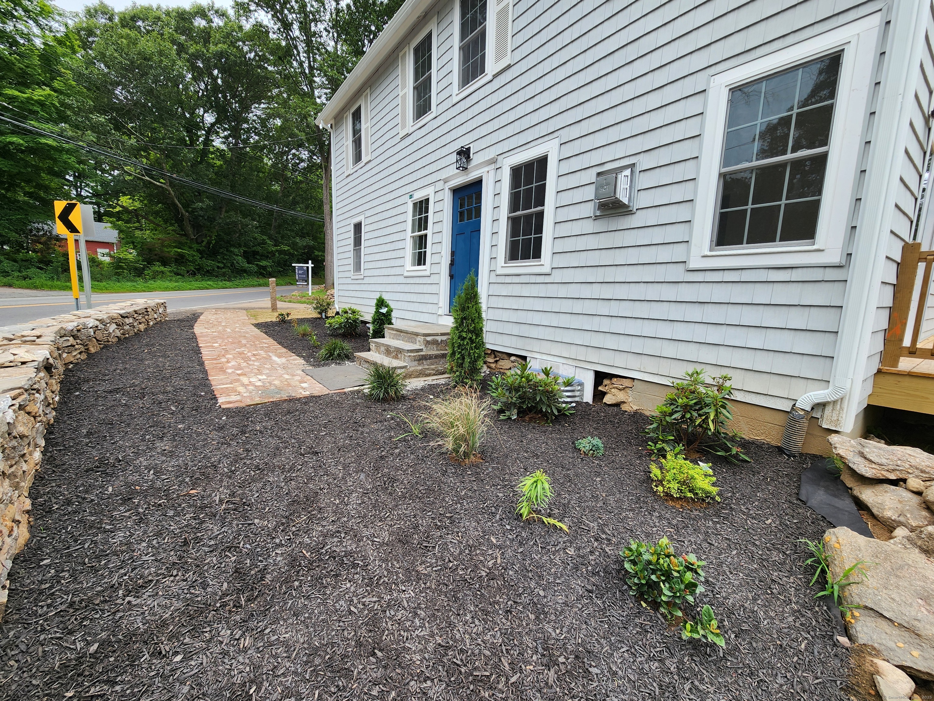 154 Falls Road East Haddam, CT 06469 - Photo 33 of 39 a view of a backyard with a garden and plants
