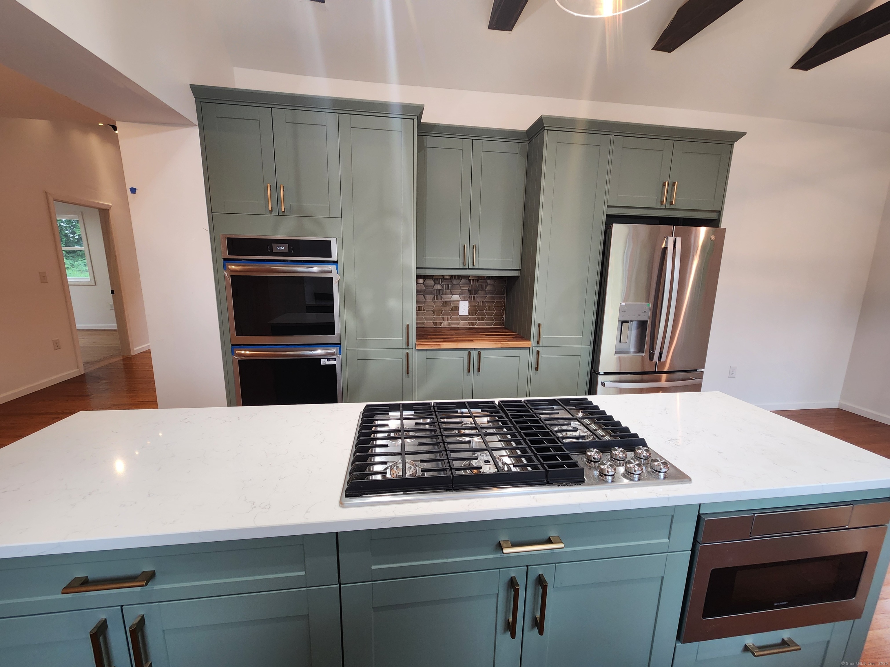 154 Falls Road East Haddam, CT 06469 - Photo 36 of 39 a kitchen with a refrigerator and a stove