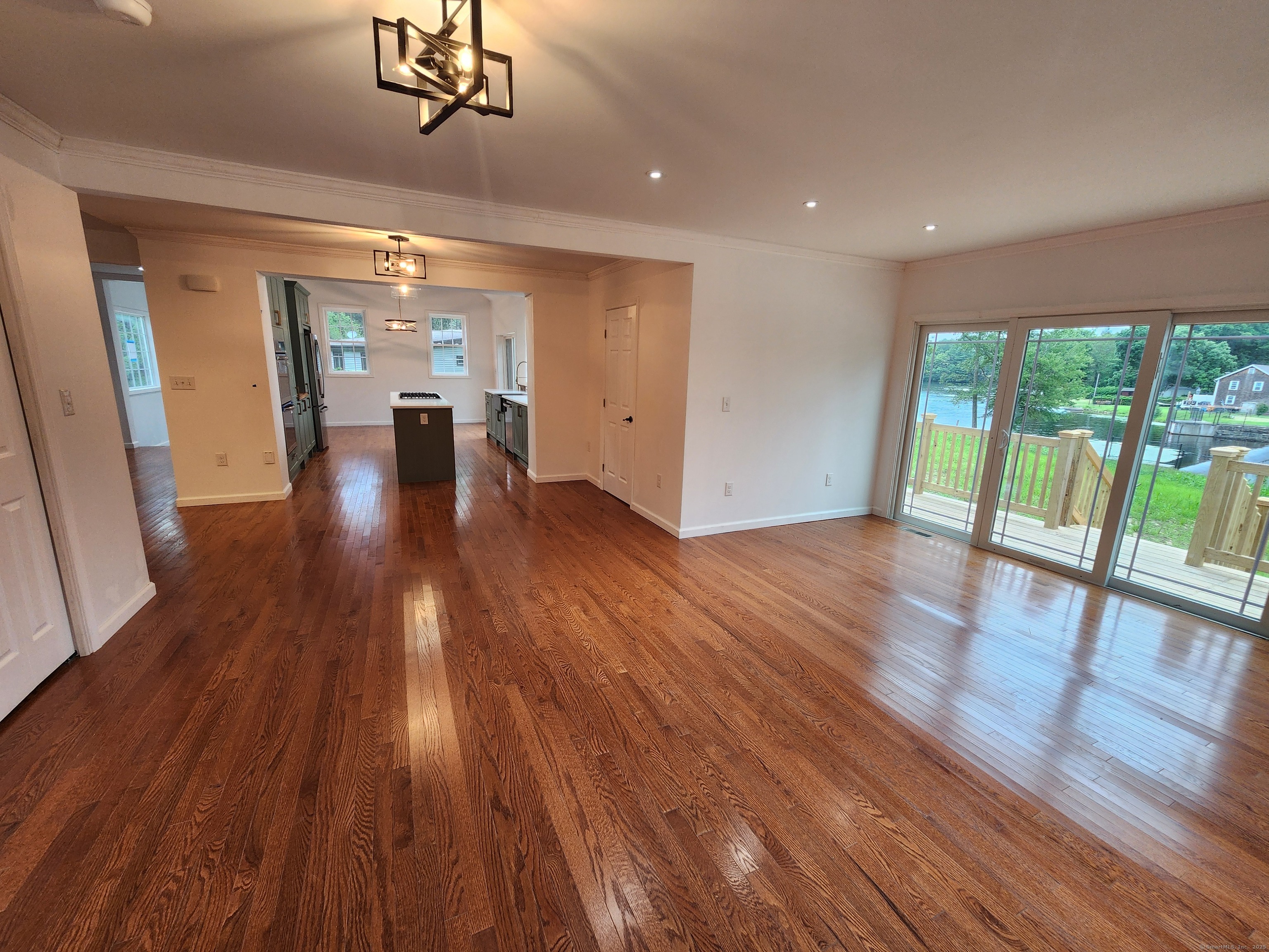 154 Falls Road East Haddam, CT 06469 - Photo 10 of 39 a view of empty room with wooden floor and fan
