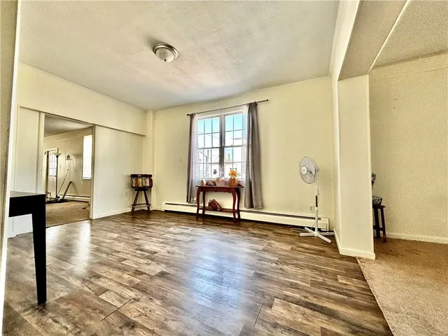 a view of a room with window and a bathroom