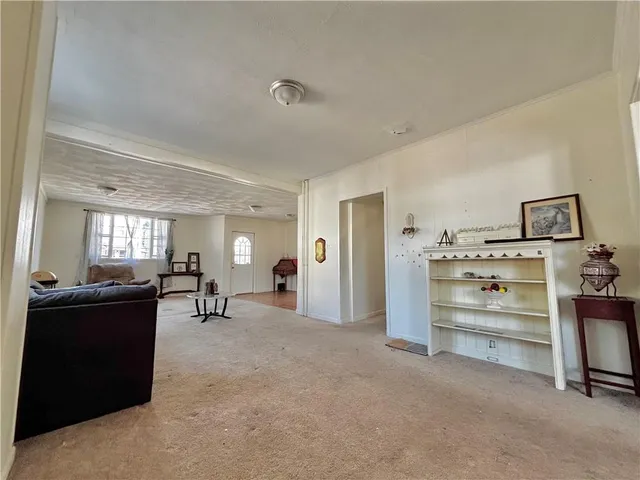 a living room with furniture and natural light