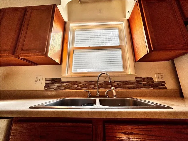 a kitchen with a sink and a stove
