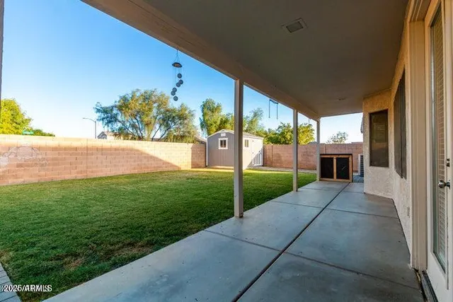 a view of a patio with a yard