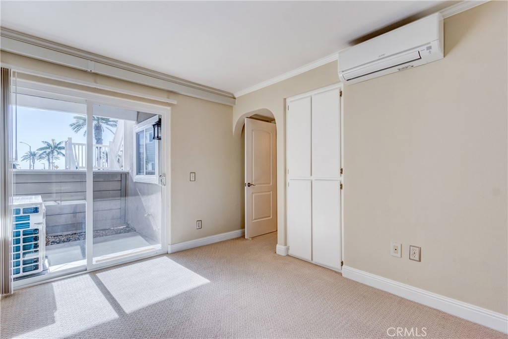 34004 Selva Road, Unit 384 Dana Point, CA 92629 - Photo 22 of 35 an empty room with sliding glass door