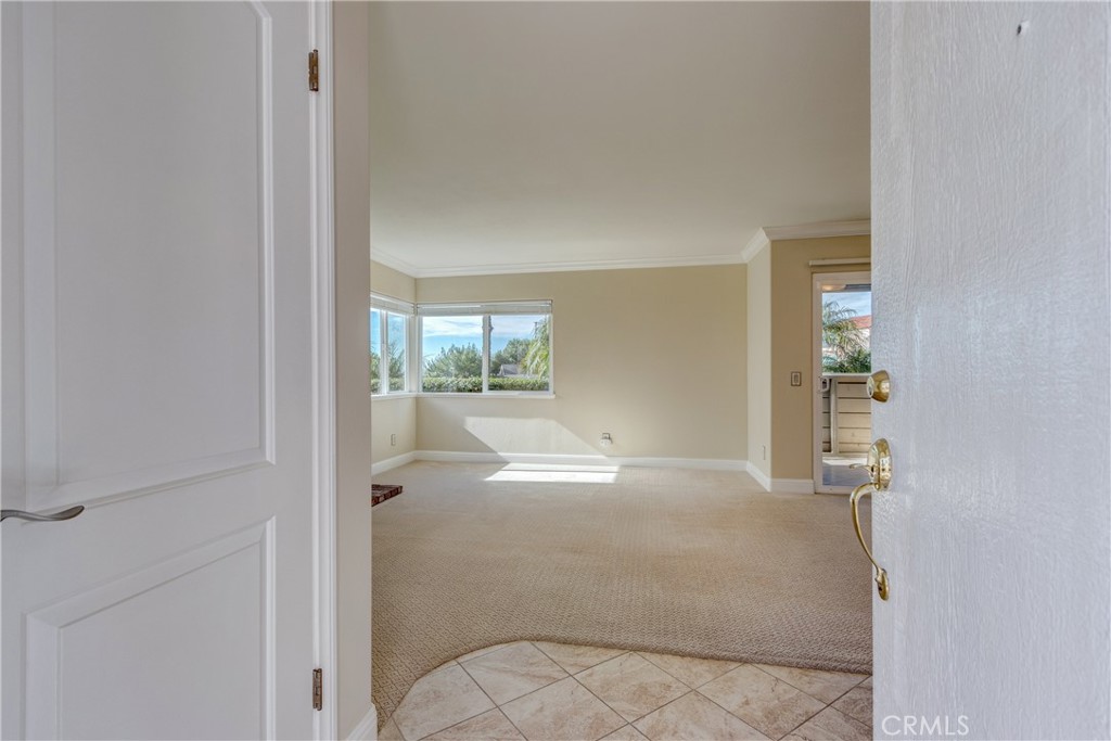 34004 Selva Road, Unit 384 Dana Point, CA 92629 - Photo 7 of 35 an empty room with windows