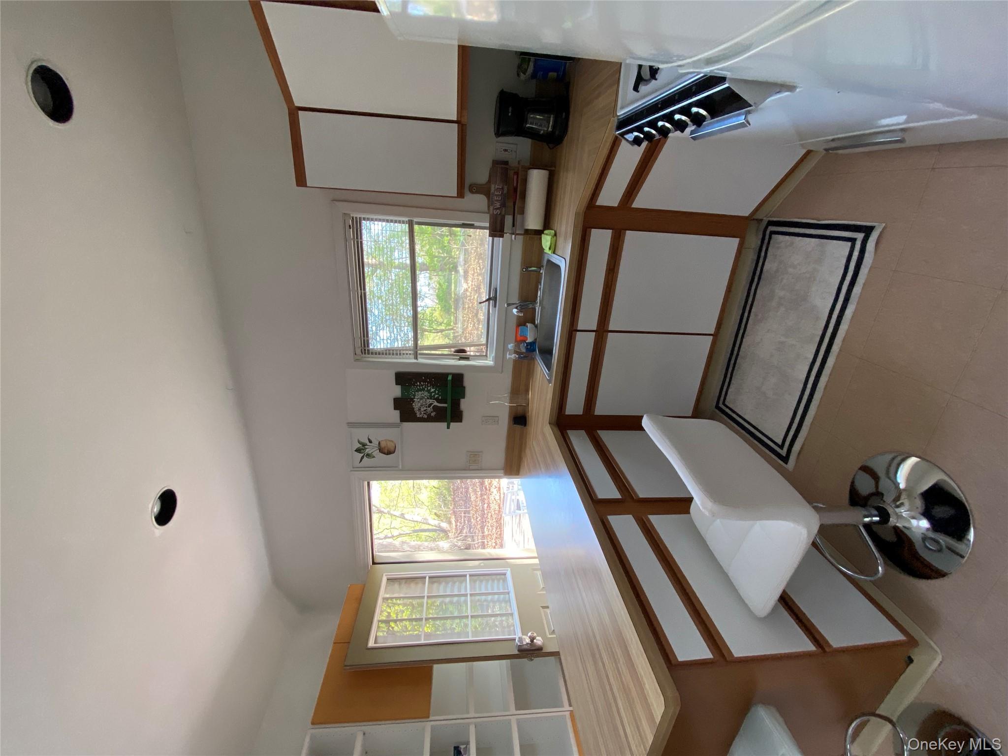 64 Hollow Road Stony Brook, NY 11790 - Photo 20 of 23 a kitchen with a sink appliances and a counter top space