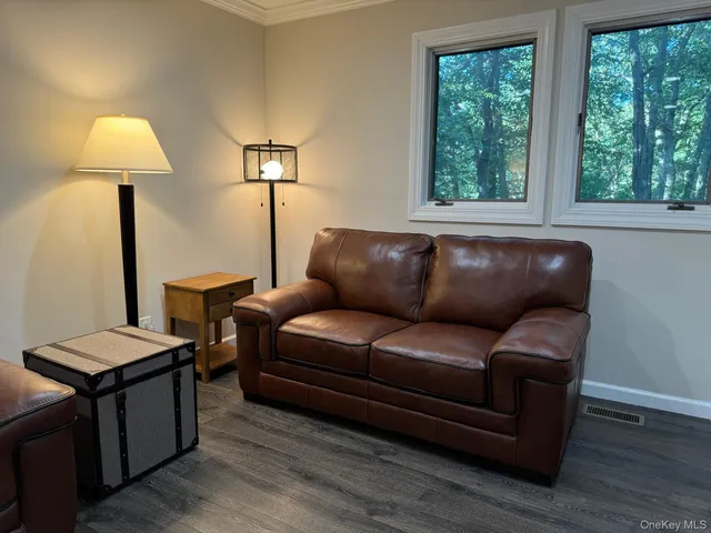 a living room with a couch and a lamp