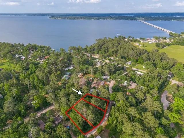 a view of a field with an ocean view