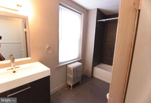 a bathroom with a sink and a tub