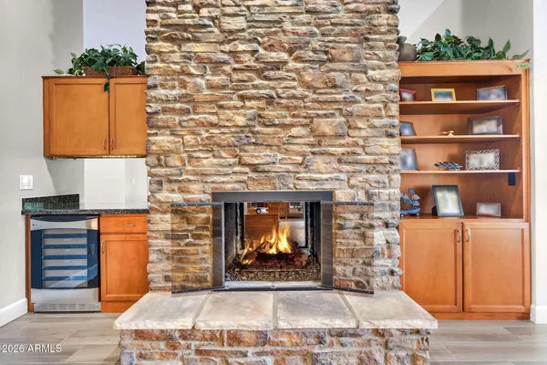 a kitchen with granite countertop stainless steel appliances a stove a microwave and cabinets