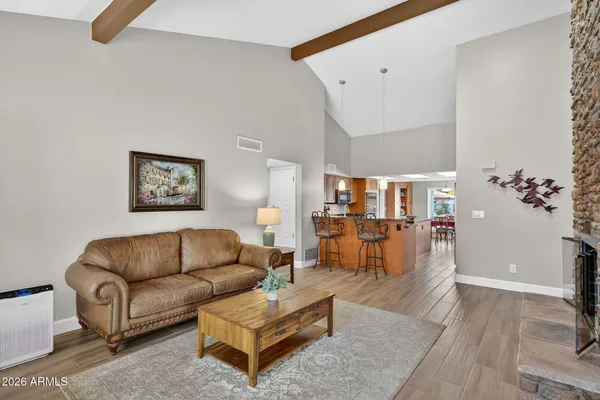 a kitchen with stainless steel appliances granite countertop a refrigerator a stove and a sink with cabinets