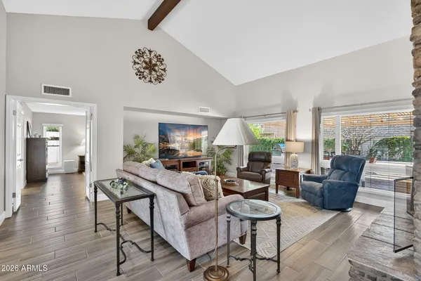 a living room with furniture and a fireplace