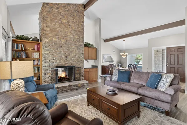 a living room with furniture and a potted plant