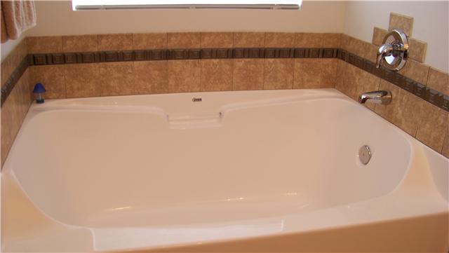 1016 Fulman Road Hendersonville, TN 37075 - Photo 8 of 14 In the master bath you'll find a separate tub with tile surround, double vanity and huge walk-in closet.