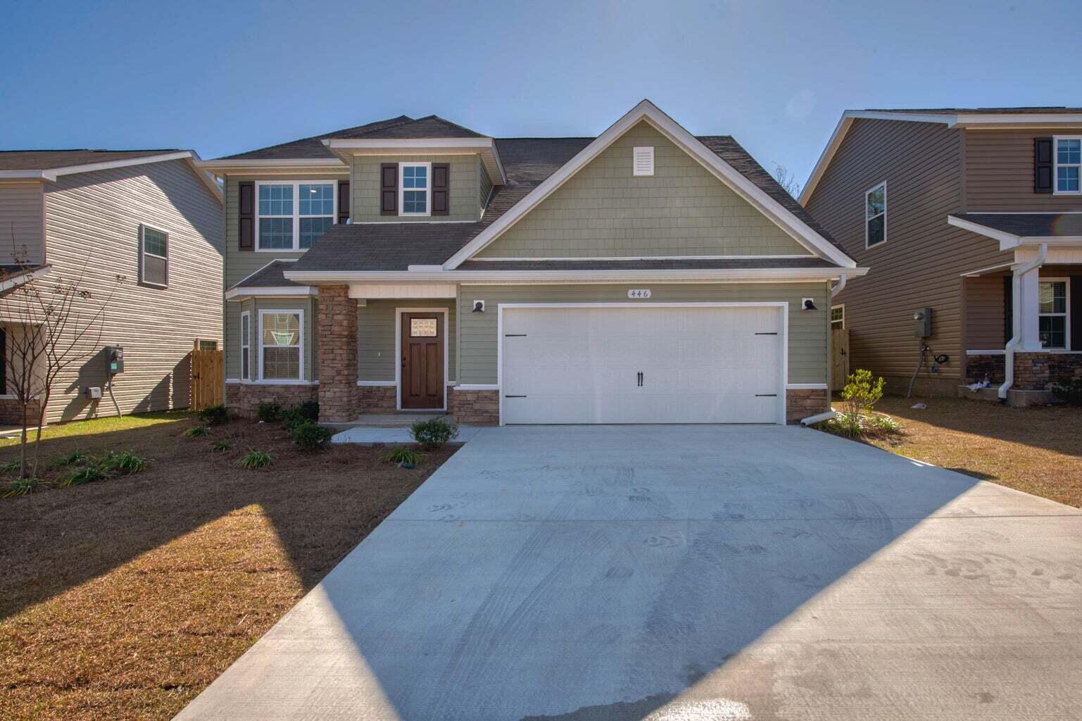 a front view of a house with a yard